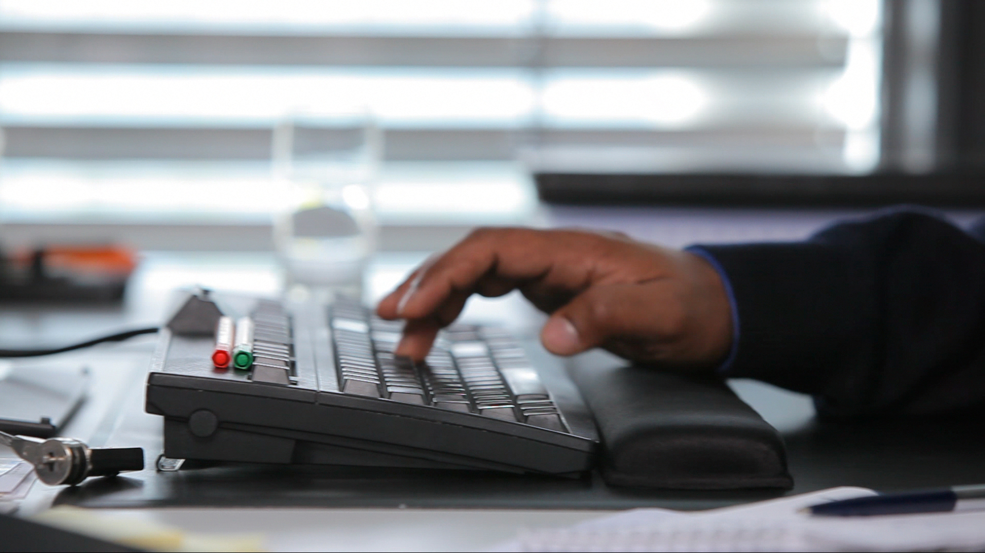 Man writes on a keyboard