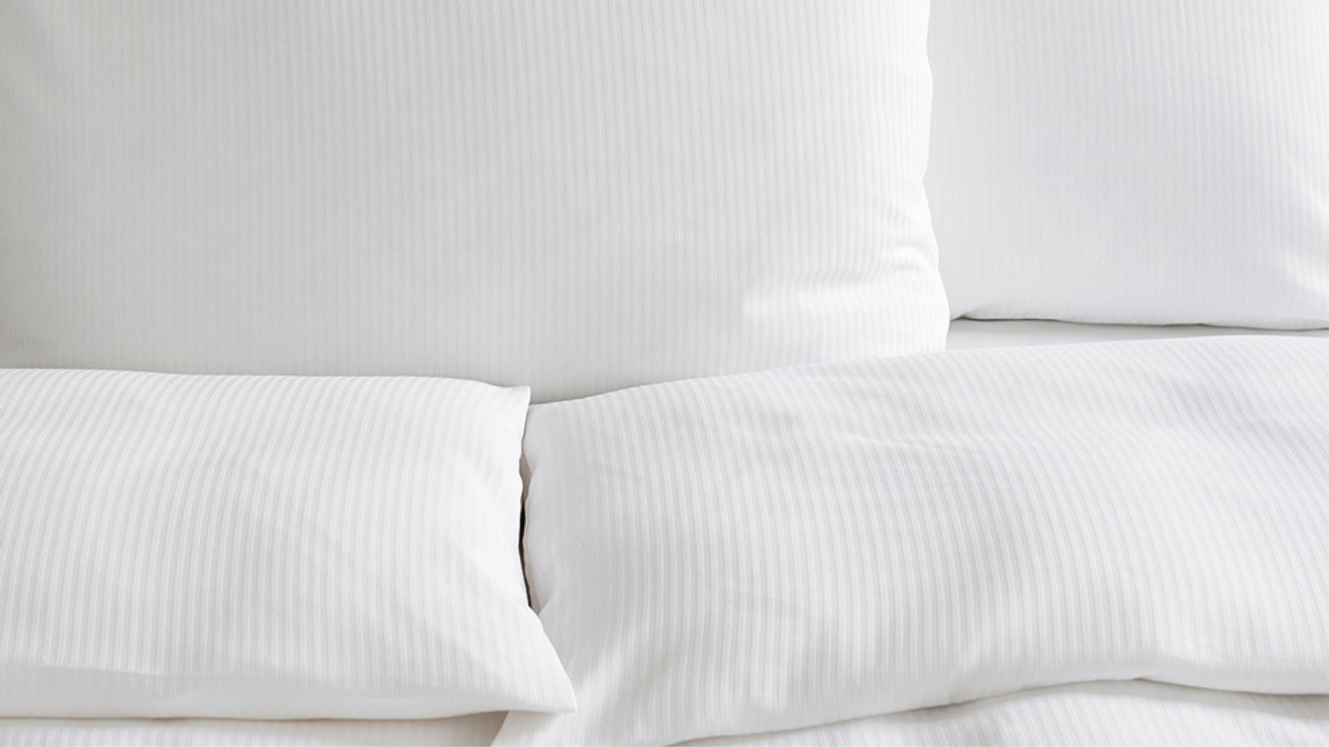 White hotel linen with subtle striped texture